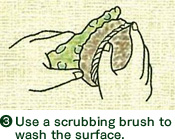 3. Use a scrubbing brush to wash the surface.